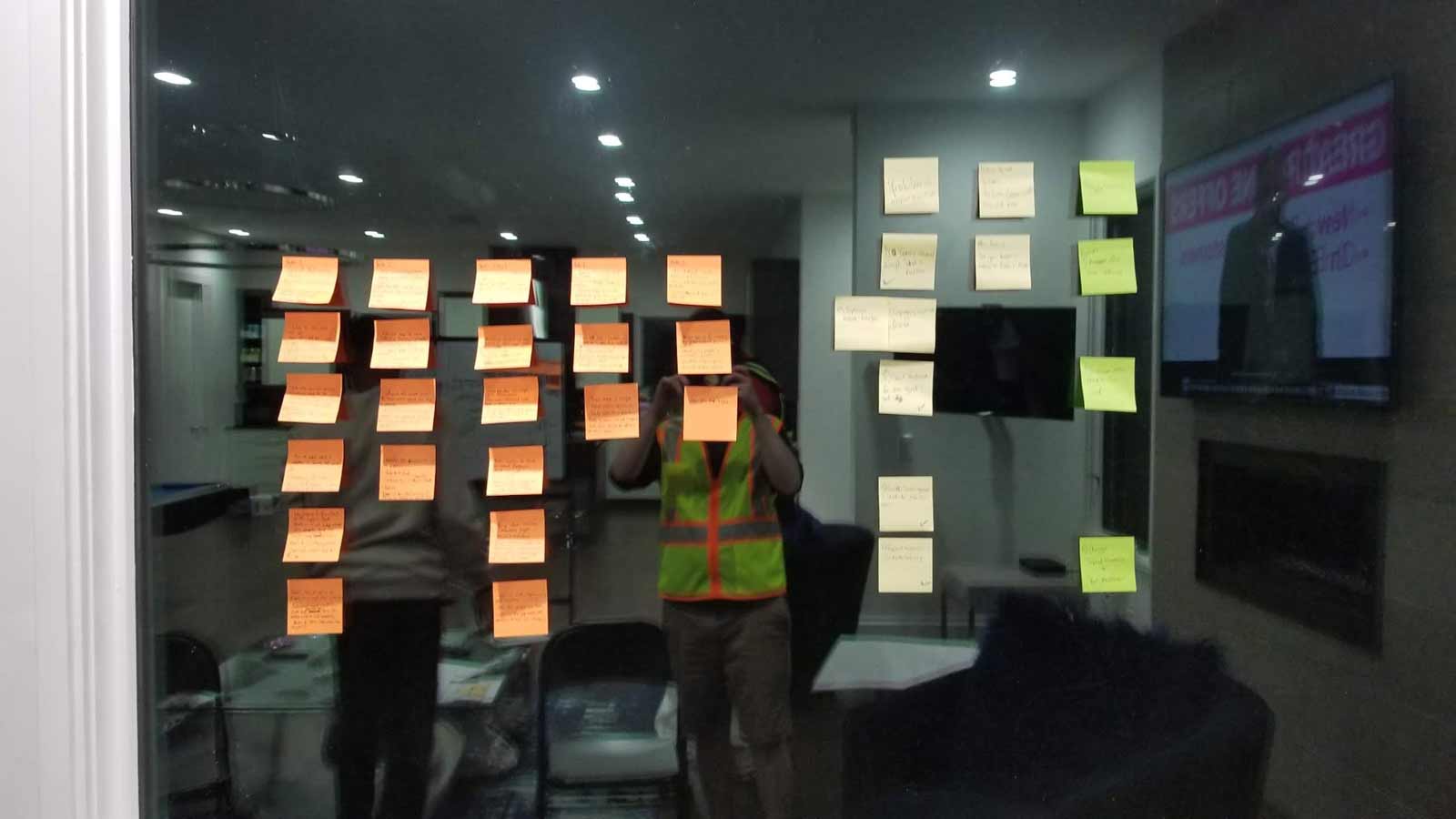 Various sticky notes on a window.